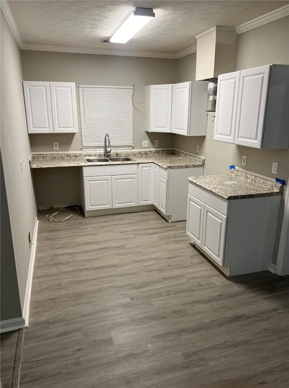 2716 Spenola Street Columbus, GA 31906 - Photo 7 of 11 a kitchen with stainless steel appliances cabinets a sink and a stove
