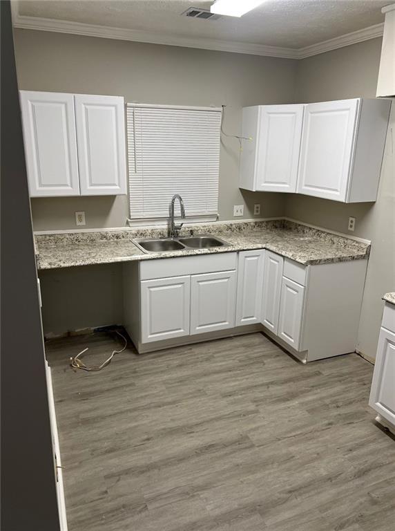 2716 Spenola Street Columbus, GA 31906 - Photo 9 of 11 a kitchen with stainless steel appliances granite countertop a sink and cabinets