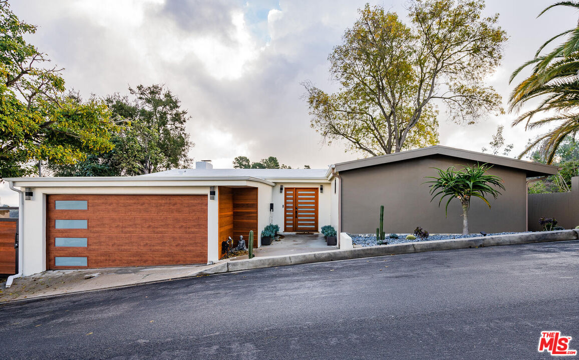 front view of a house with a street