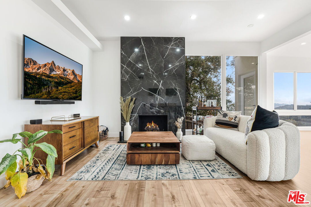 2204 Ridgemont Drive Los Angeles, CA 90046 - Photo 12 of 34 a living room with furniture and a flat screen tv
