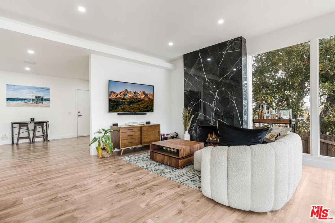 2204 Ridgemont Drive Los Angeles, CA 90046 - Photo 13 of 34 a living room with furniture and a flat screen tv