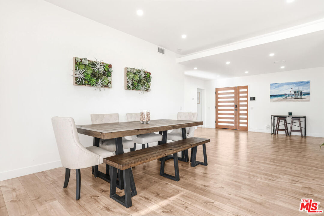 2204 Ridgemont Drive Los Angeles, CA 90046 - Photo 15 of 34 a view of a dining room with furniture and wooden floor