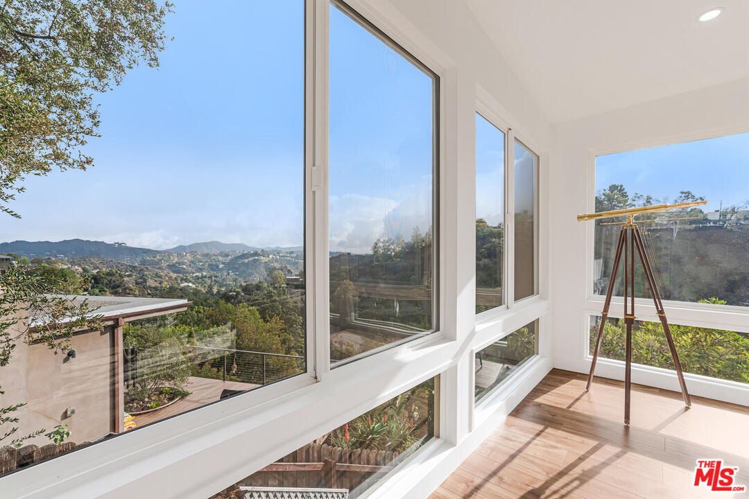 2204 Ridgemont Drive Los Angeles, CA 90046 - Photo 17 of 34 a view of a balcony with furniture