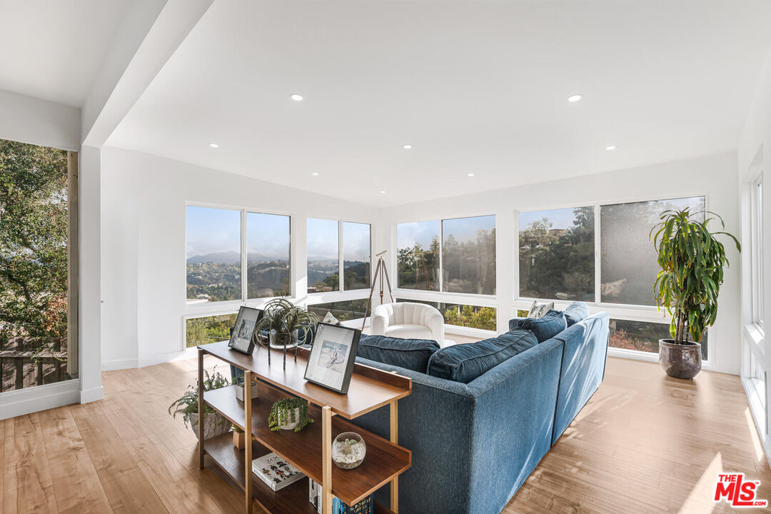2204 Ridgemont Drive Los Angeles, CA 90046 - Photo 18 of 34 a living room with furniture and a large window