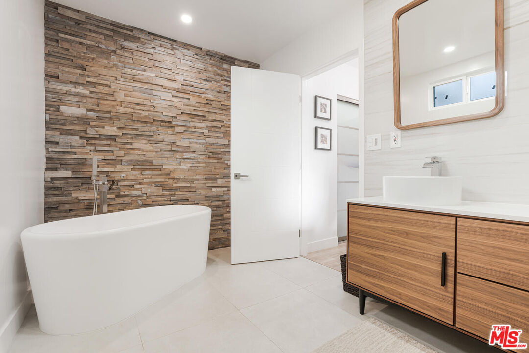 2204 Ridgemont Drive Los Angeles, CA 90046 - Photo 27 of 34 a bathroom with a bathtub and a shower