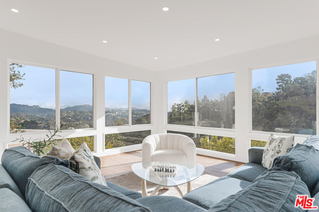 2204 Ridgemont Drive Los Angeles, CA 90046 - Photo 3 of 34 a living room with furniture and a large window