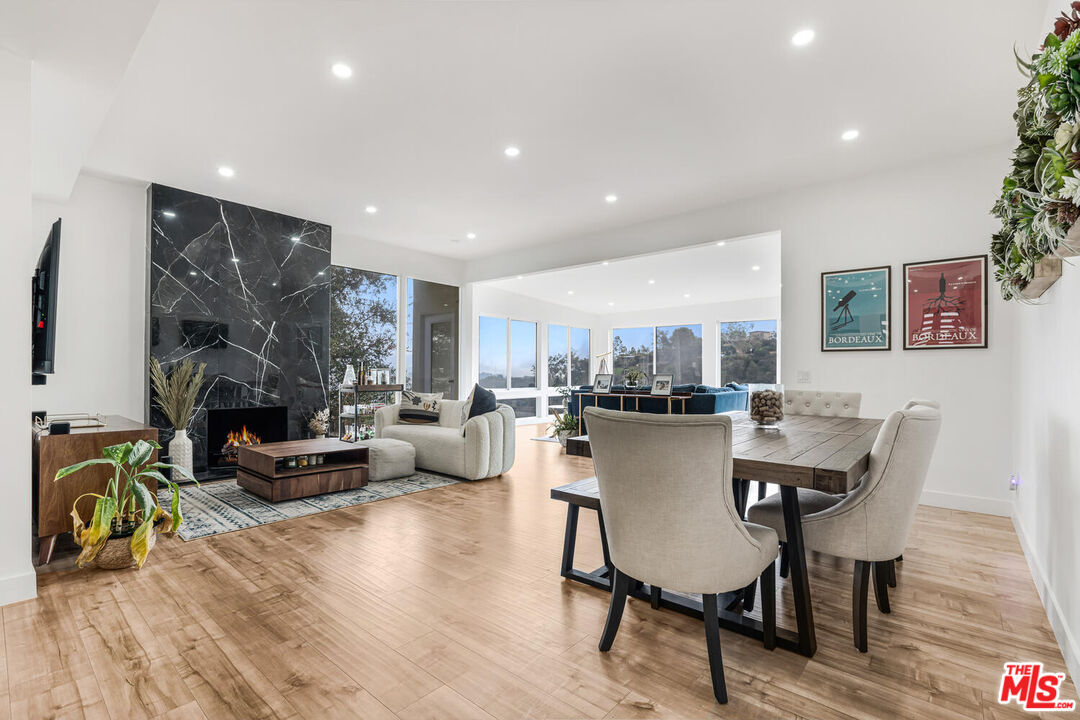 2204 Ridgemont Drive Los Angeles, CA 90046 - Photo 9 of 34 a dining room with furniture and wooden floor