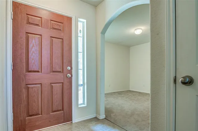 an empty room with closet area