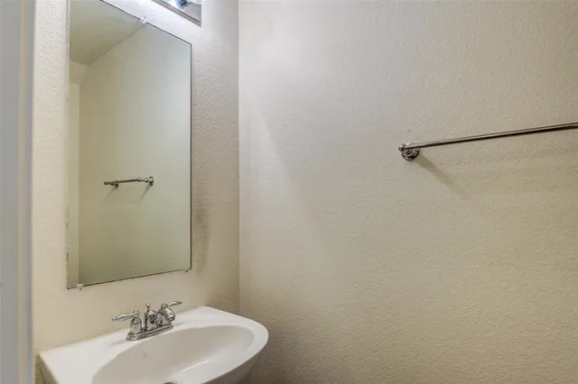 a view of outdoor space with wooden fence and tall trees