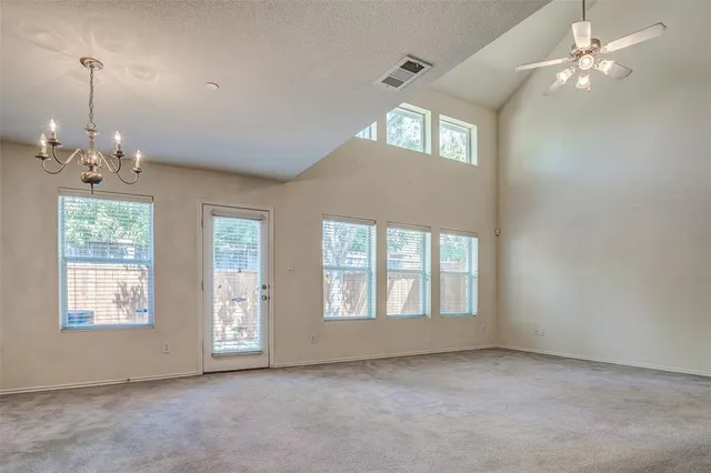 a view of an empty room with windows
