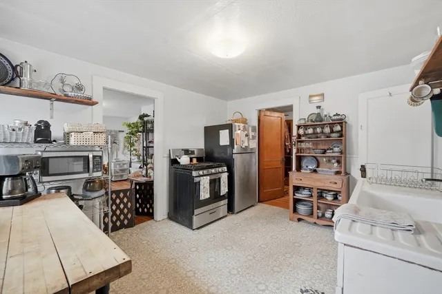 a room with furniture a rug and a window