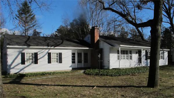 131 Cedar Road Longmeadow, MA 01106 - Photo 1 of 4 a front view of a house with a garden