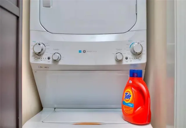 a bed room with a bed and a chair