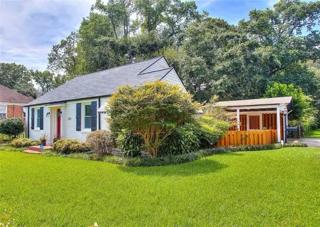 a front view of house with yard and green space