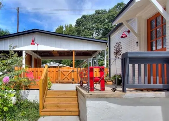 a front view of a house with a yard and lake view