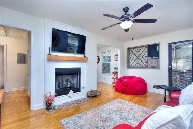 a living room with furniture and a fireplace