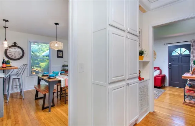 a view of living room with furniture and wooden floor