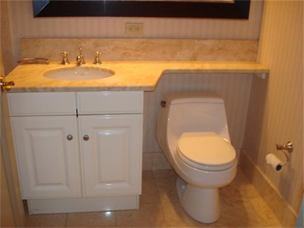 3 Avery Street, Unit 810 Boston, MA 02111 - Photo 11 of 16 a bathroom with a sink and a toilet