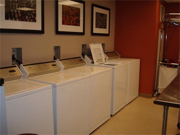 3 Avery Street, Unit 810 Boston, MA 02111 - Photo 12 of 16 a utility room with dryer and washer