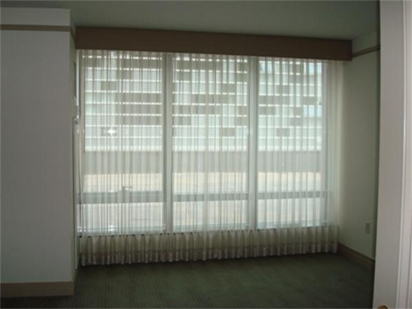 3 Avery Street, Unit 810 Boston, MA 02111 - Photo 2 of 16 a view of wooden floor and a window