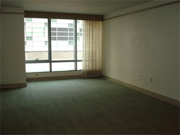 3 Avery Street, Unit 810 Boston, MA 02111 - Photo 3 of 16 an empty room with a window