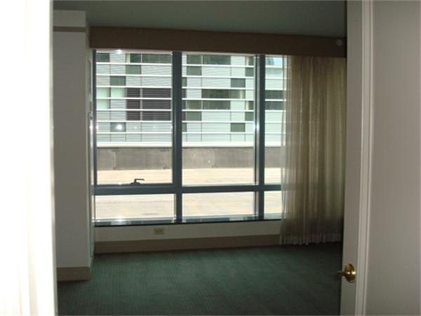 3 Avery Street, Unit 810 Boston, MA 02111 - Photo 6 of 16 a view of a room that has a bed in it