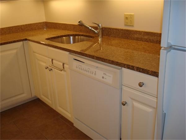 3 Avery Street, Unit 810 Boston, MA 02111 - Photo 10 of 16 a view of a sink and dishwasher with cabinets