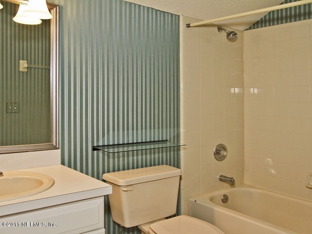 12930 Biggin Church Road South Jacksonville, FL 32224 - Photo 10 of 25 a bathroom with a sink a toilet and shower