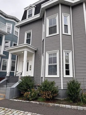a front view of a house with yard