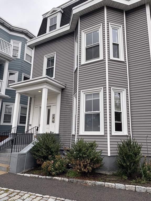 a front view of a house with yard