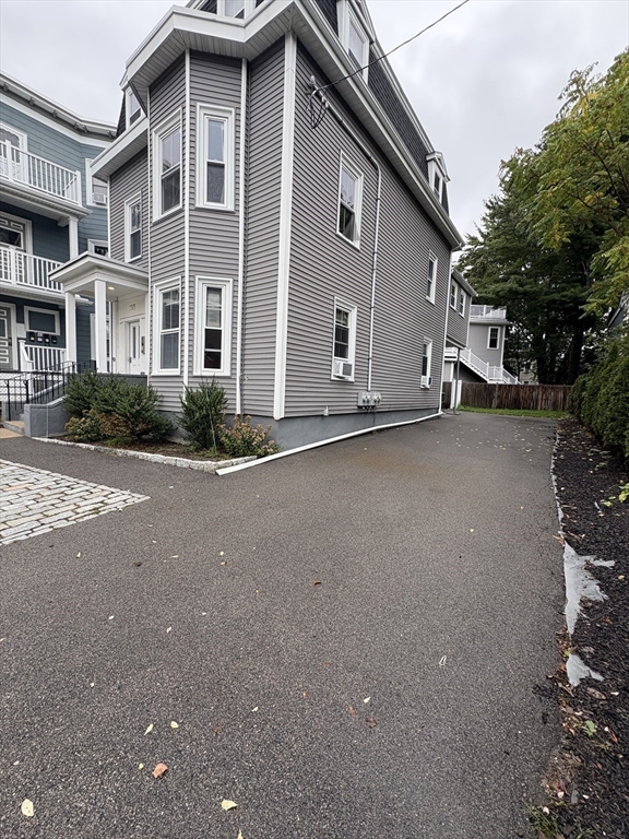 755 Somerville Avenue, Unit PARKING Somerville, MA 02143 - Photo 2 of 4 a view of a house with a street