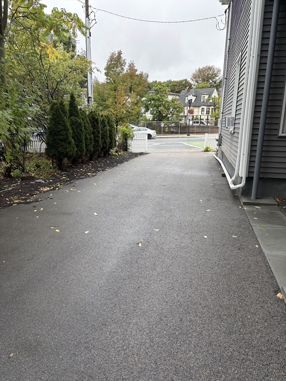 755 Somerville Avenue, Unit PARKING Somerville, MA 02143 - Photo 4 of 4 a view of a road with a building in the background