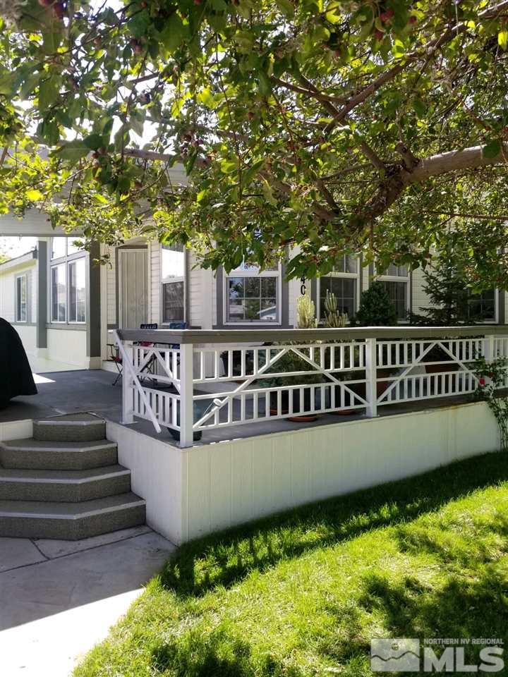 240 Magnolia Way Reno, NV 89506 - Photo 1 of 9 a view of a house with large pool and wooden fence