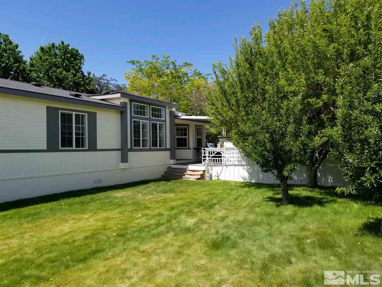 240 Magnolia Way Reno, NV 89506 - Photo 3 of 9 a view of a house with pool and a yard
