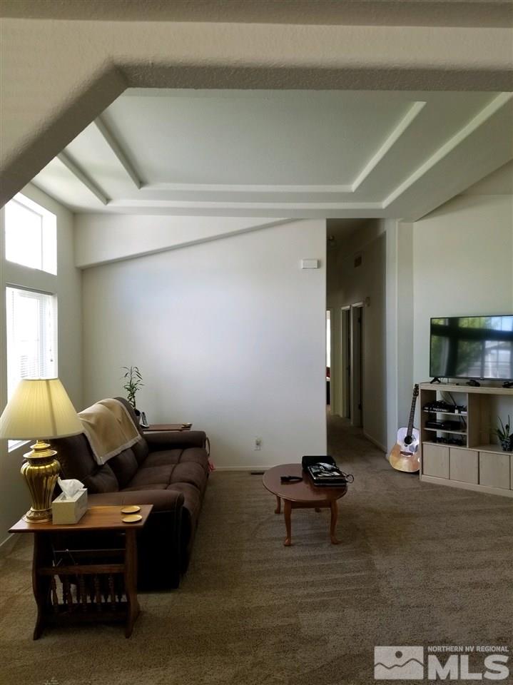 240 Magnolia Way Reno, NV 89506 - Photo 8 of 9 a living room with furniture and a flat screen tv
