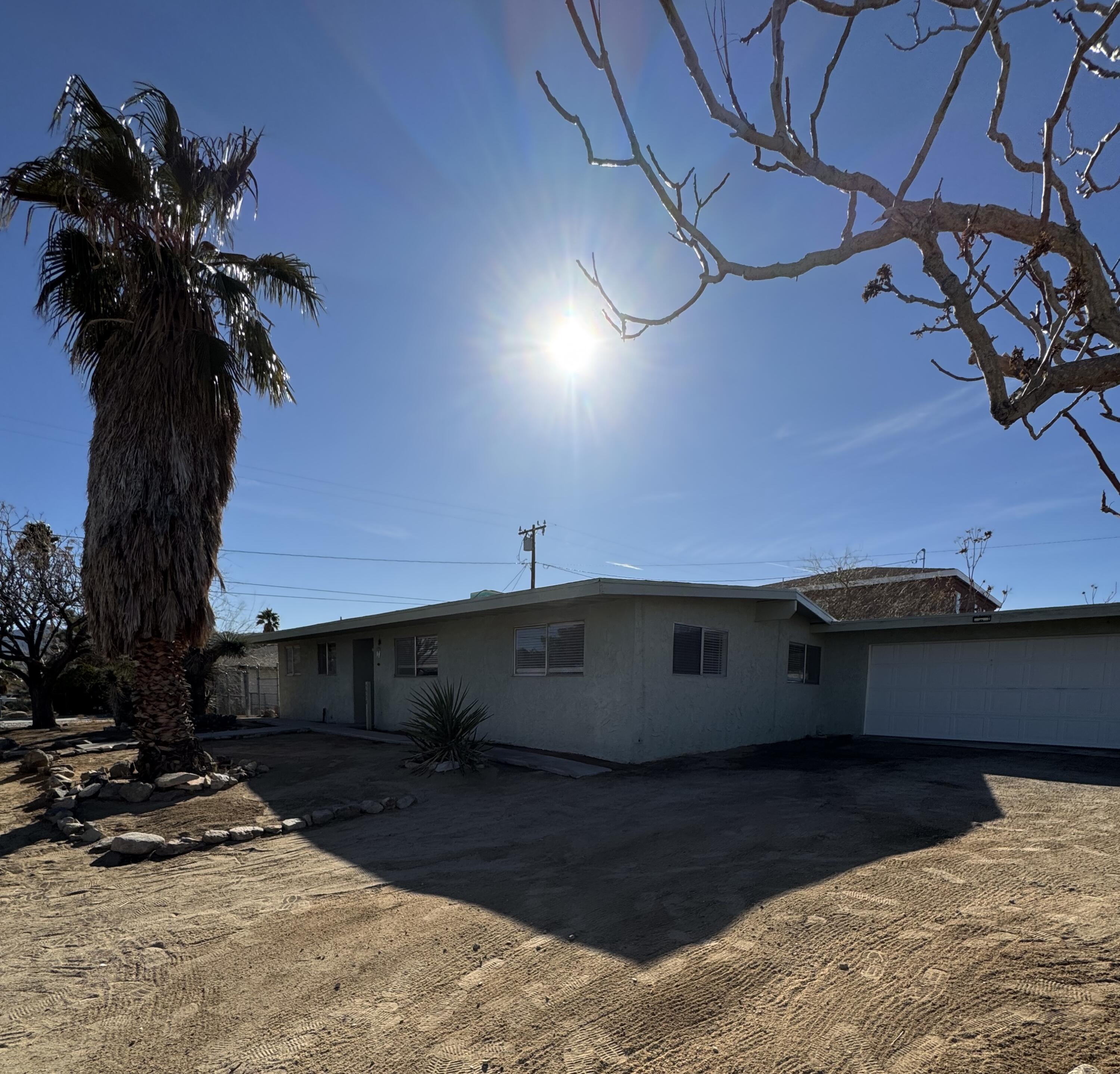 5958 El Reposo Street Joshua Tree, CA 92252 - Photo 13 of 30 a view of a house with a yard