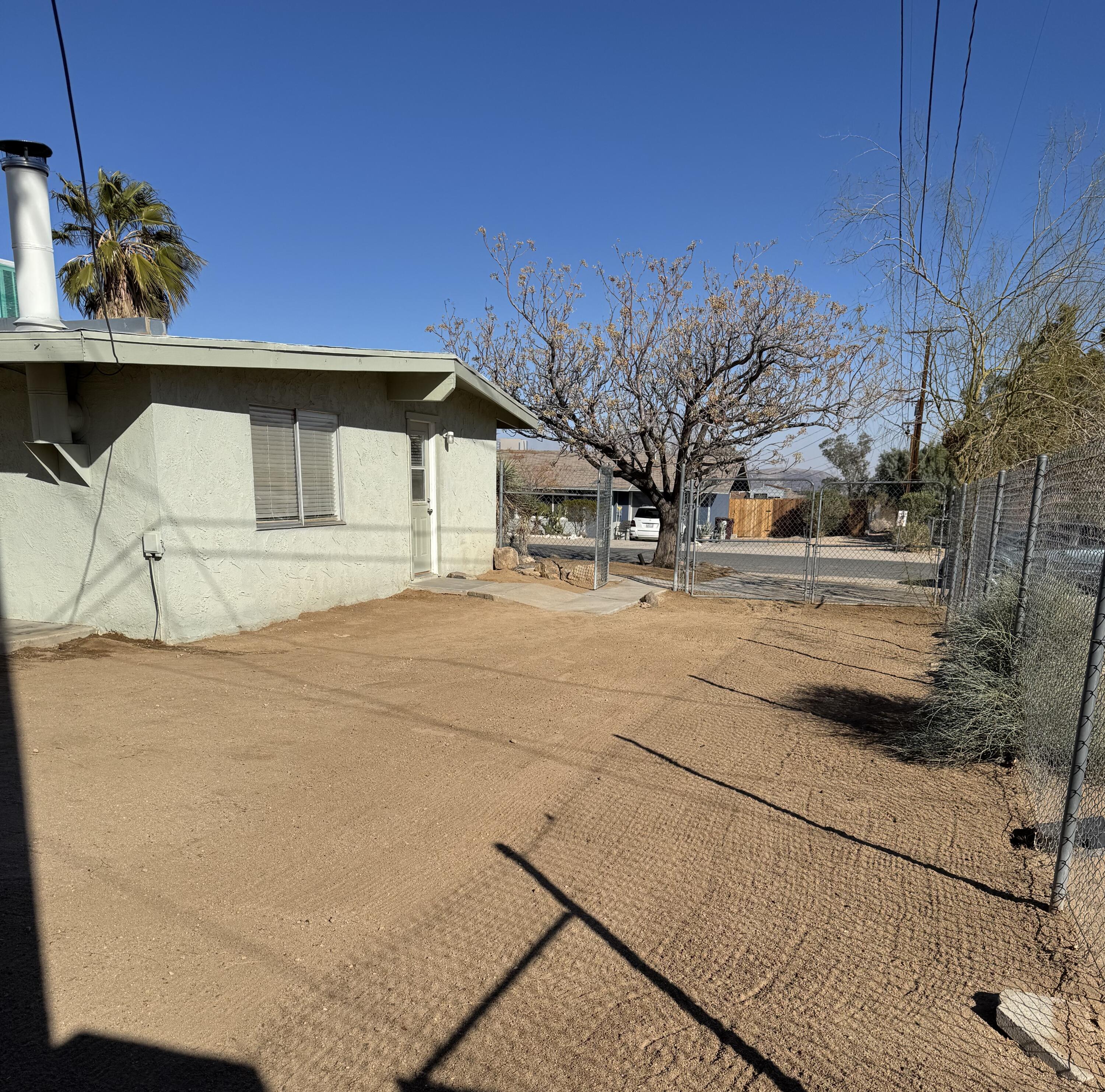 5958 El Reposo Street Joshua Tree, CA 92252 - Photo 14 of 30 a view of a house with a snow on the wall