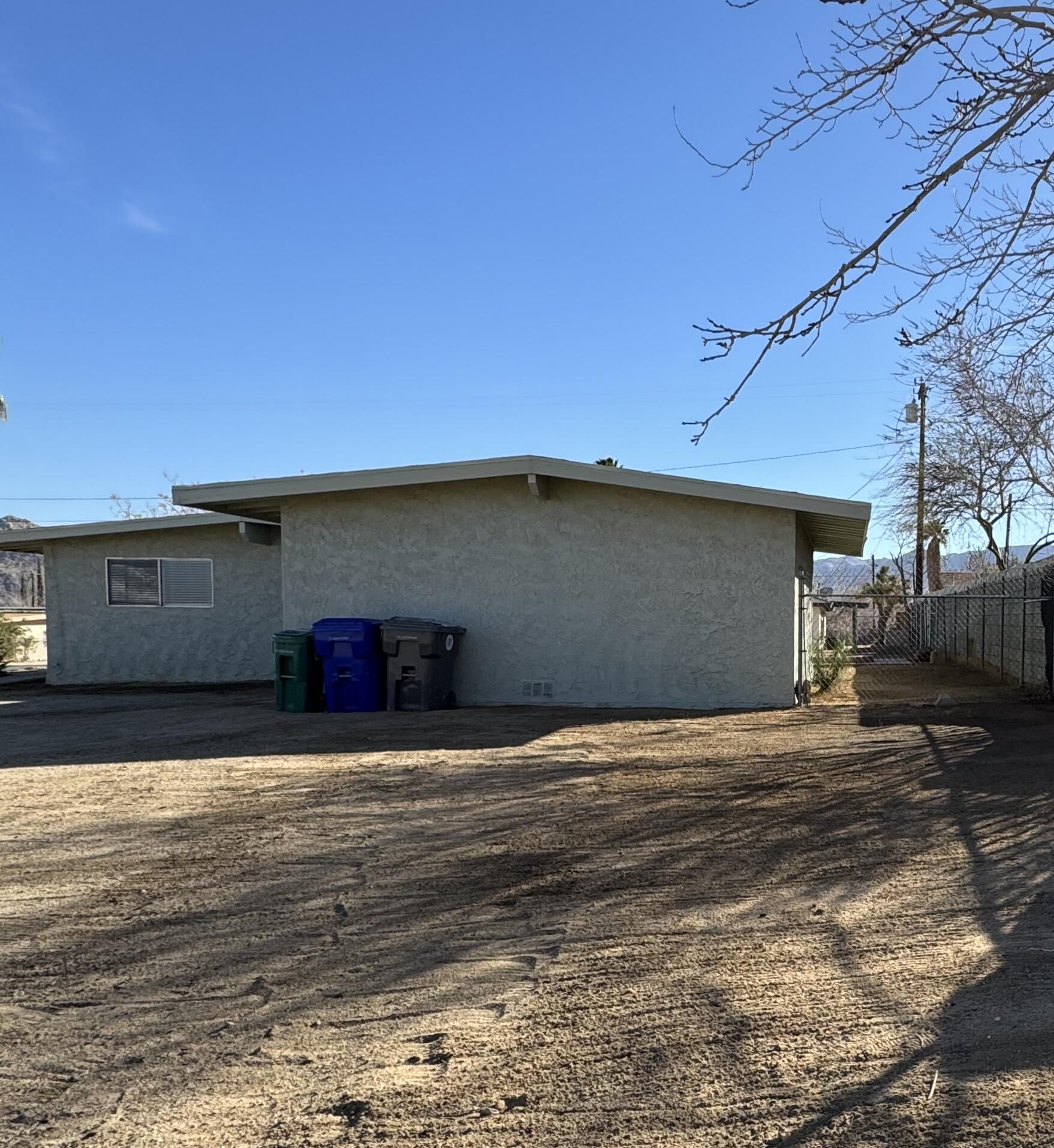 5958 El Reposo Street Joshua Tree, CA 92252 - Photo 10 of 30 a view of a house with a yard