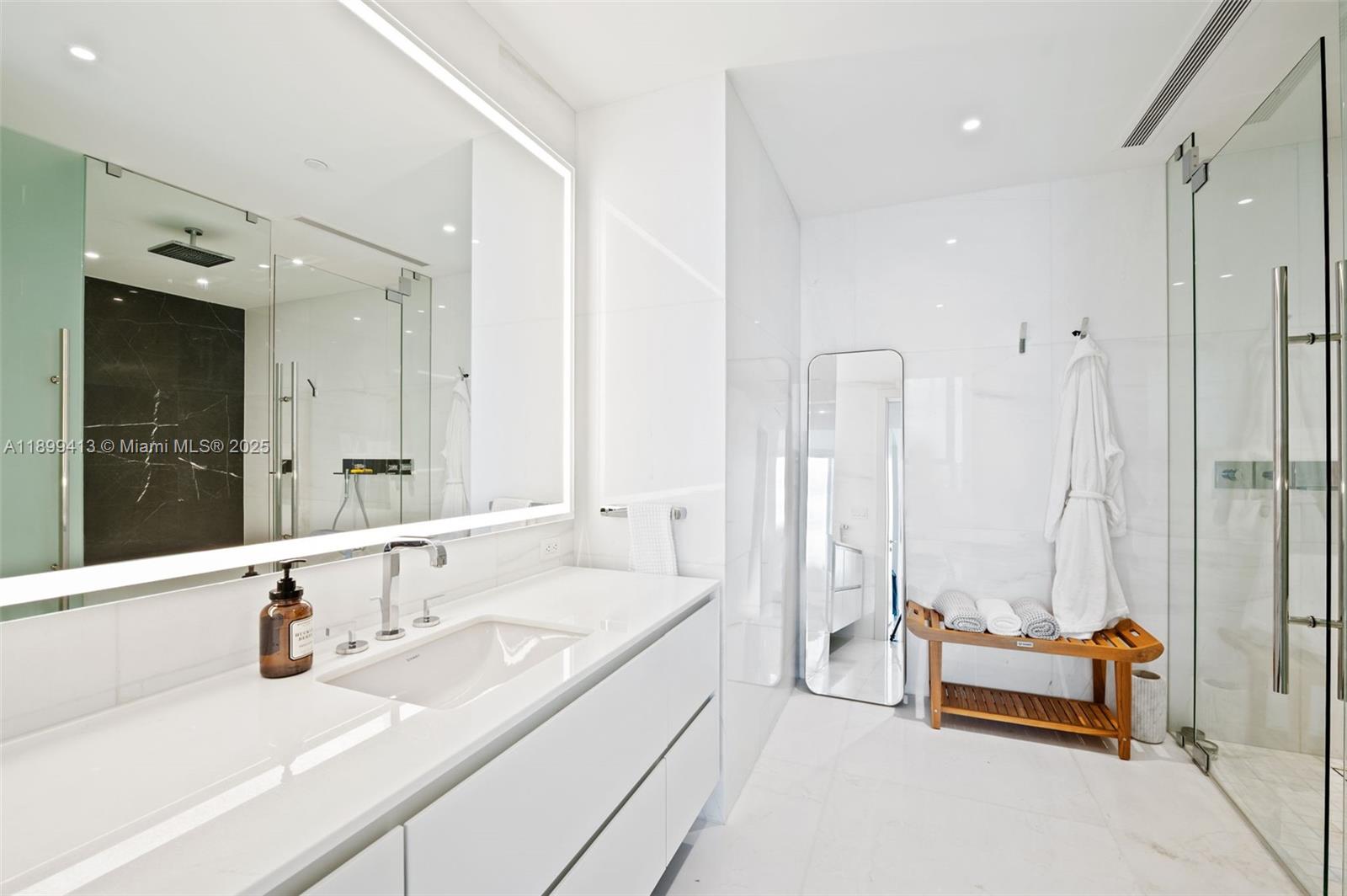 300 Biscayne Blvd Way, Unit 4909W Miami, FL 33131 - Photo 17 of 47 a bathroom with a tub sink and mirror