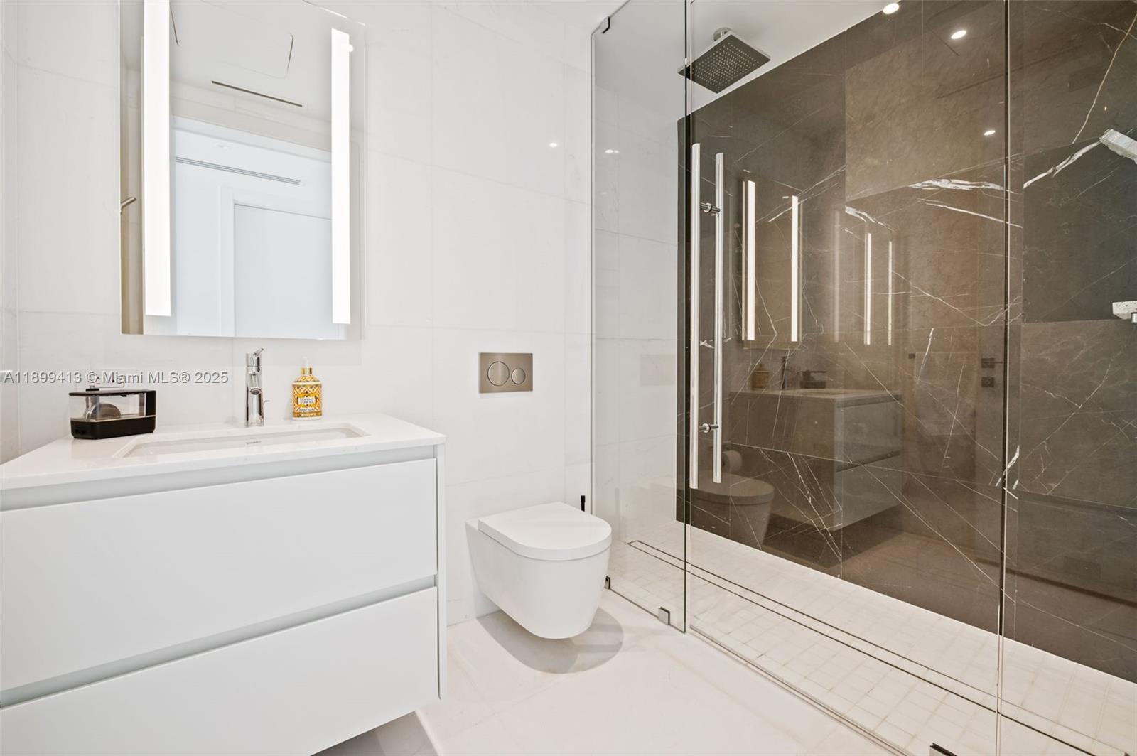 300 Biscayne Blvd Way, Unit 4909W Miami, FL 33131 - Photo 20 of 47 a bathroom with a sink a toilet and shower