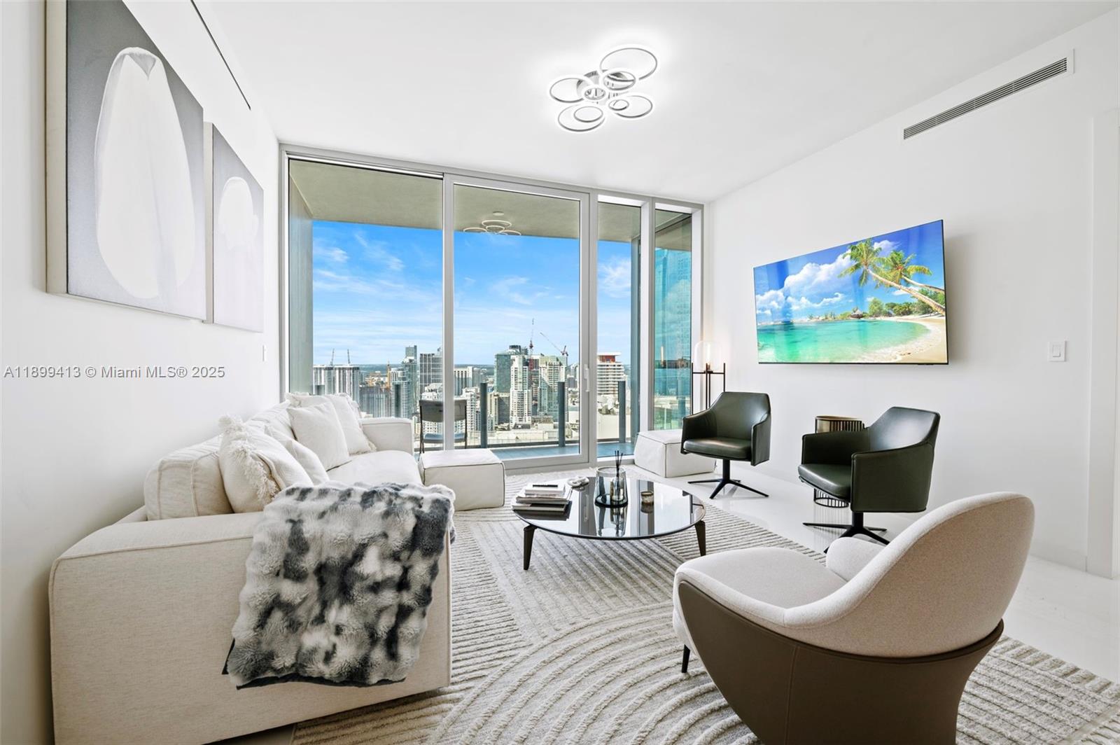 300 Biscayne Blvd Way, Unit 4909W Miami, FL 33131 - Photo 2 of 47 a living room with furniture and a large window