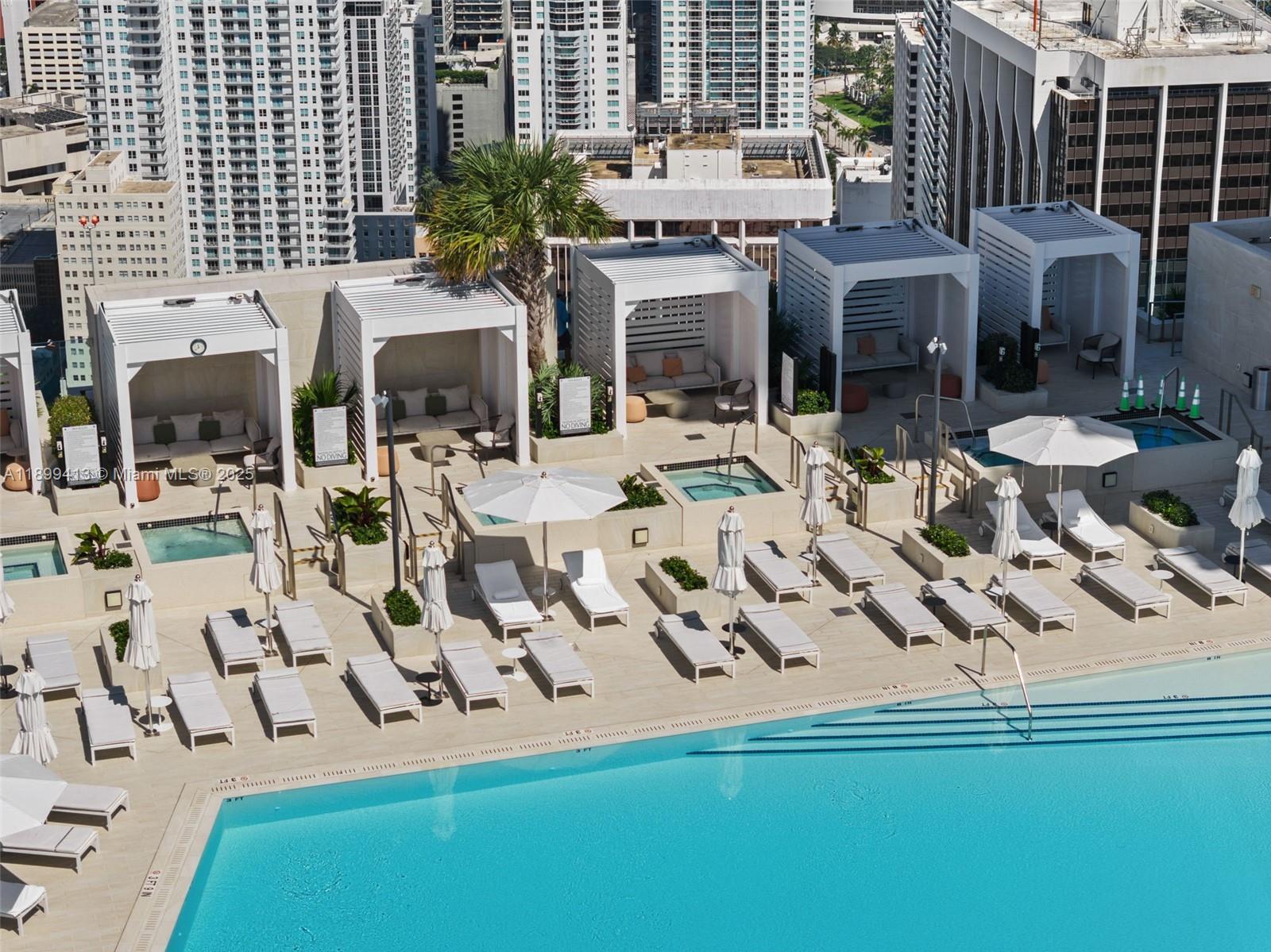 300 Biscayne Blvd Way, Unit 4909W Miami, FL 33131 - Photo 31 of 47 a view of a patio with table and chairs and potted plants