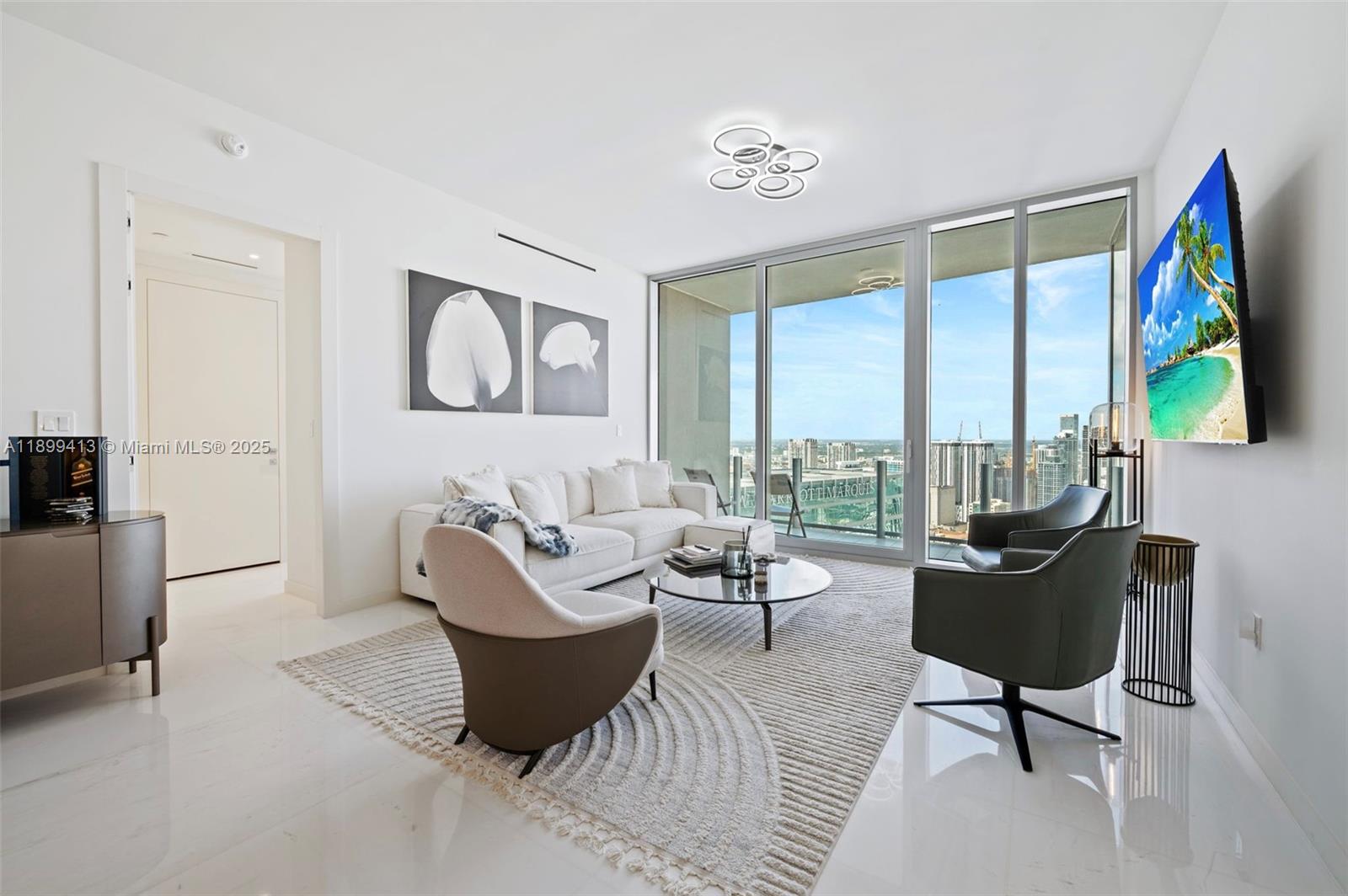 300 Biscayne Blvd Way, Unit 4909W Miami, FL 33131 - Photo 9 of 47 a living room with furniture and a large window