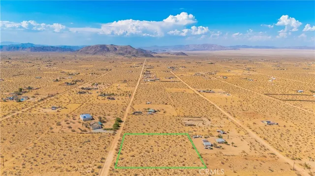a view of a yard with a mountain