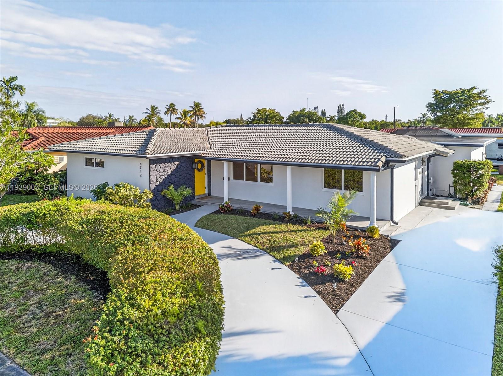 a front view of a house with garden