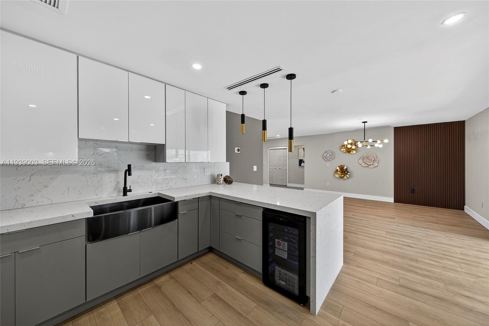 4712 Cleveland Street Hollywood, FL 33021 - Photo 20 of 49 a kitchen with stainless steel appliances granite countertop a sink a stove and a refrigerator