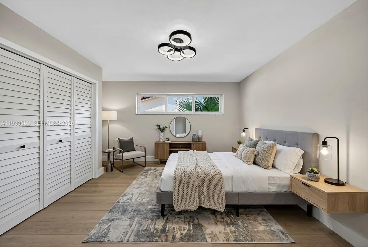 4712 Cleveland Street Hollywood, FL 33021 - Photo 27 of 49 a bedroom with bed and window