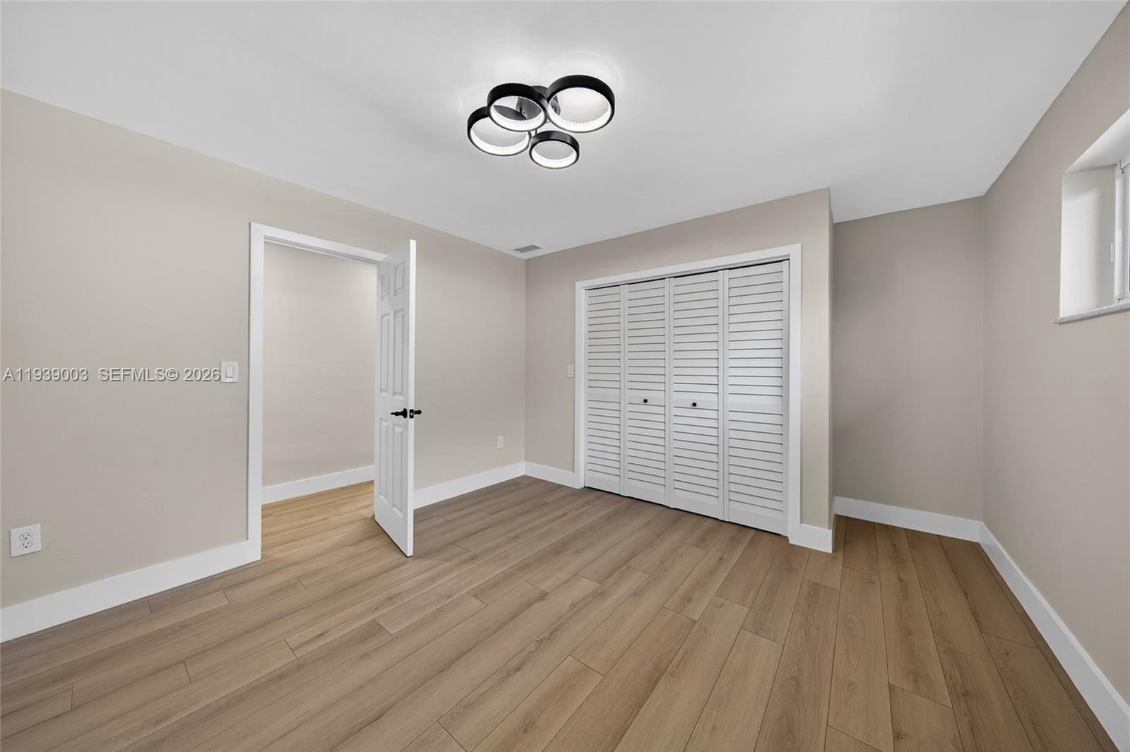 4712 Cleveland Street Hollywood, FL 33021 - Photo 28 of 49 a view of an empty room with wooden floor