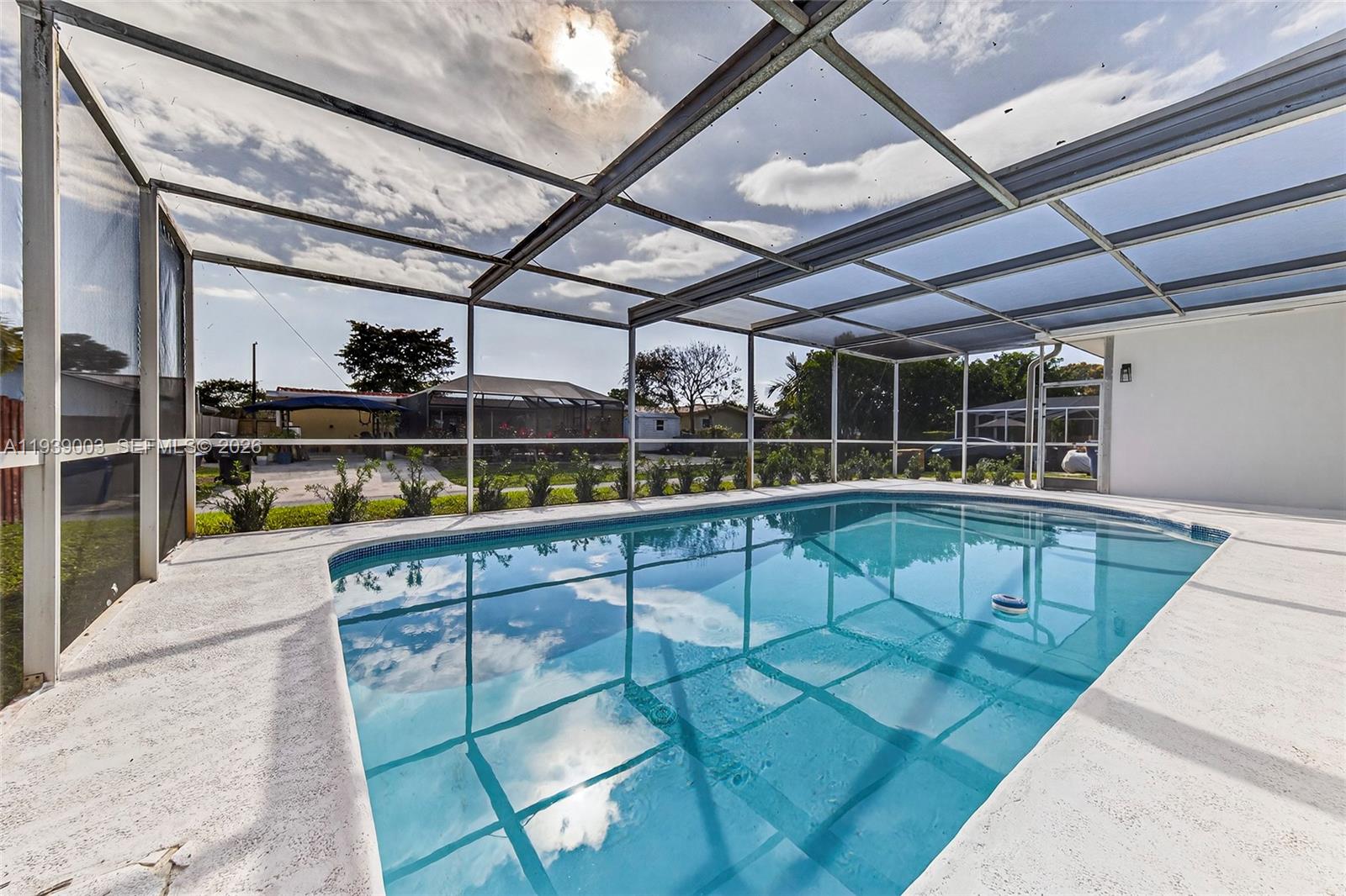 4712 Cleveland Street Hollywood, FL 33021 - Photo 38 of 49 a view of a swimming pool with a patio