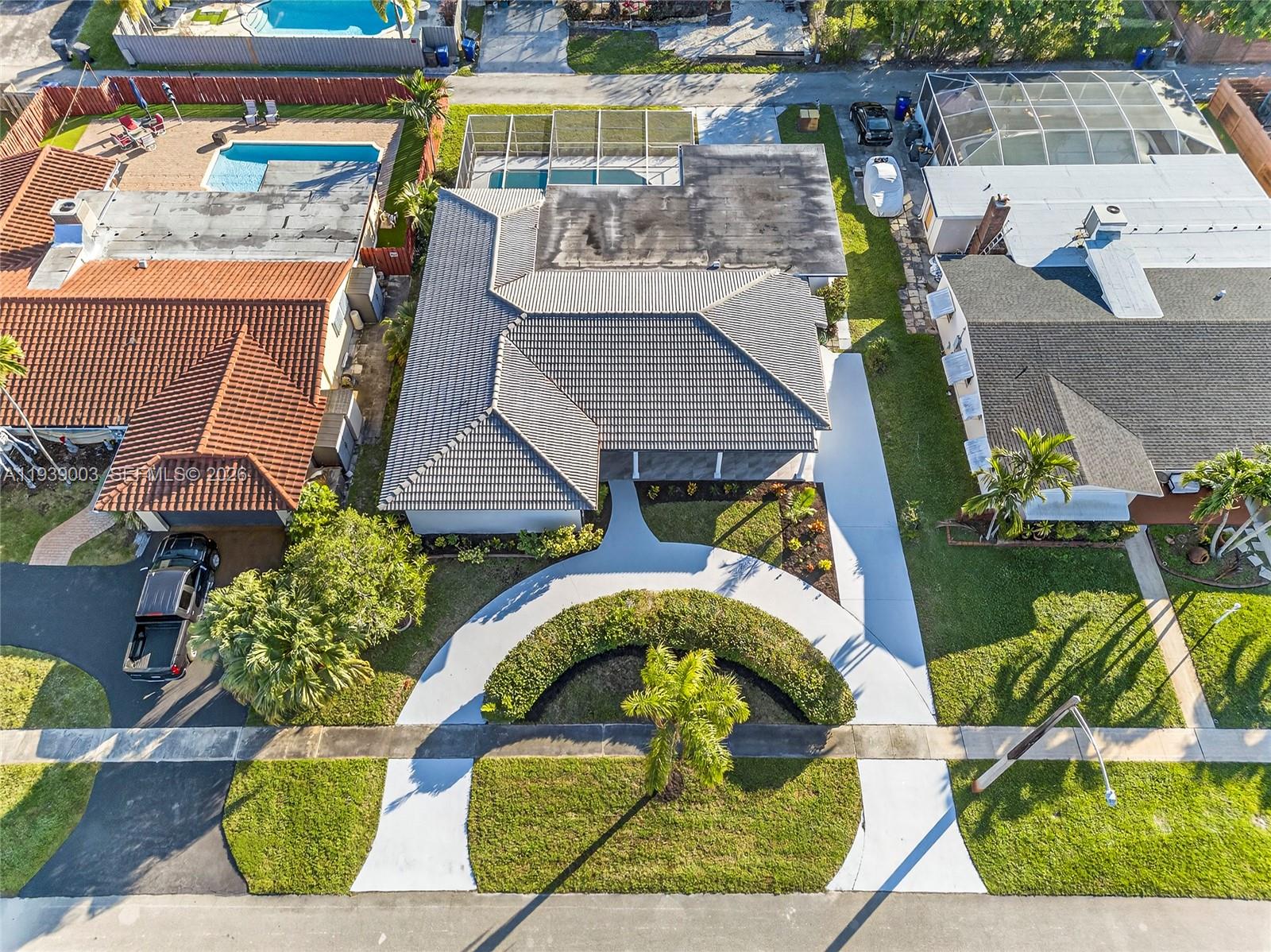 4712 Cleveland Street Hollywood, FL 33021 - Photo 47 of 49 an aerial view of a house with a swimming pool